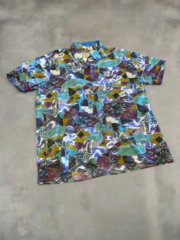 Colorful mosaic patterned fabric on a beige surface