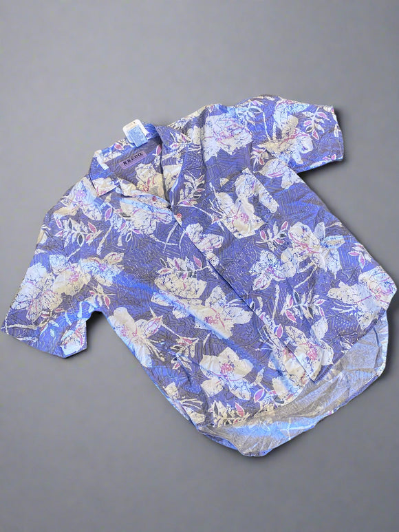 Floral-patterned pants on a concrete floor
